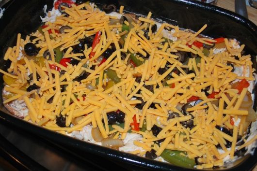 Layer on olives and cheese. Layers 7 & 8. Mexican Lasagna steps 7 & 8