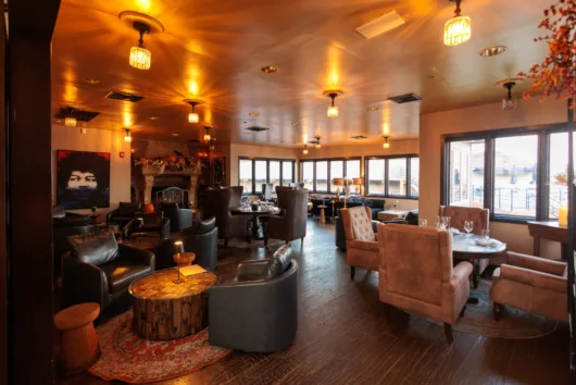 The cozy and romantic fireplace lounge is the perfect spot for an intimate evening at Drifthouse