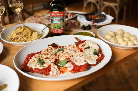 A table of classic Italian dishes at Luigino's in Montclair NJ. Luigino's has become a local Montclair favorite and considered one of the best restaurants in New Jersey.