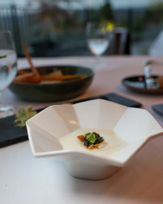 Sunchoke velouté topped with crispy sunchoke chips, chervil, and Marshallberg Ossetra caviar at Restaurant Latour.