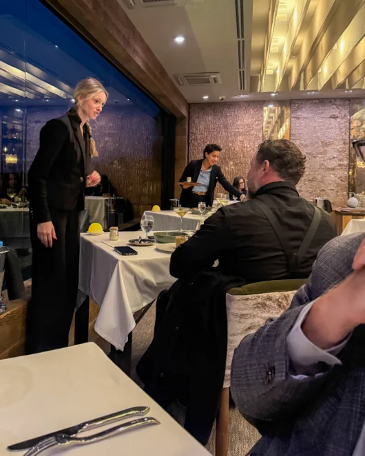 Two servers attending to guests at Restaurant Latour at Crystal Springs Resort.