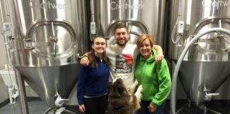 It's Bring Your Family to Work Day at Departed Soles. Brian with his mother, cousin Molly and his dog Bogan.