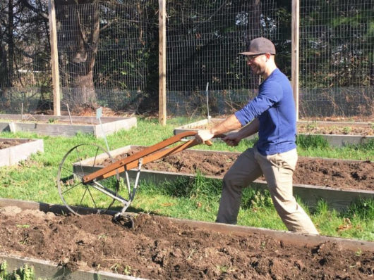 Plowing the raised beds of Fulfill's Garden