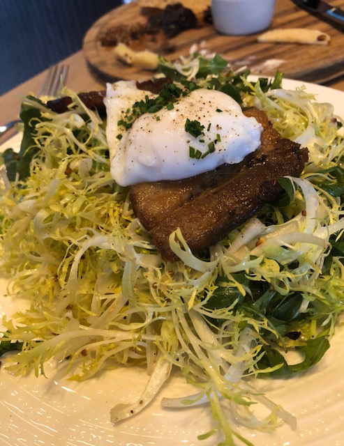 Frisée and Pork Belly Salad with a Soft Poached Egg and Mustard Vinaigrette