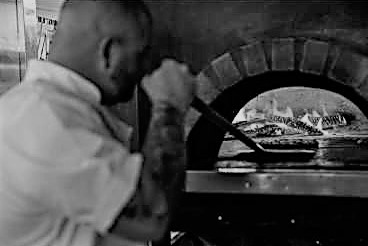 Chef Chez cooking pizza