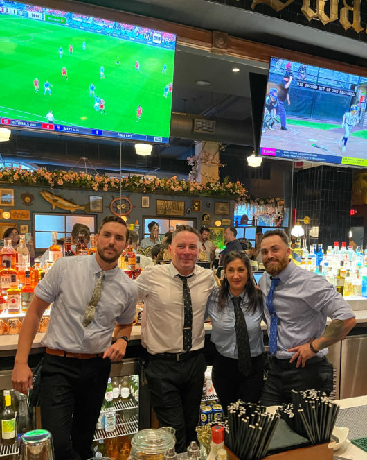 bartenders behind bar