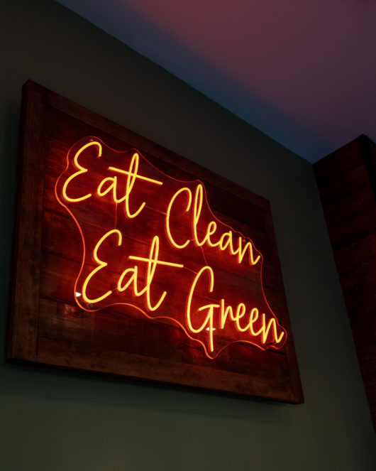 Eat Clean Eat Green sign at worldFLATS