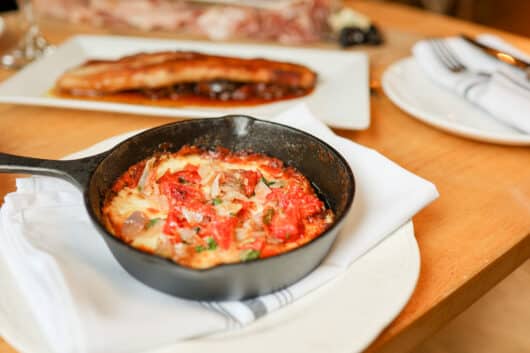 Cast-iron caciocavallo affumicato with roasted shallots, tomato, basil confit, Luigino’s Parmigiana, Montclair, Jersey Bites, Ryan Gallagher