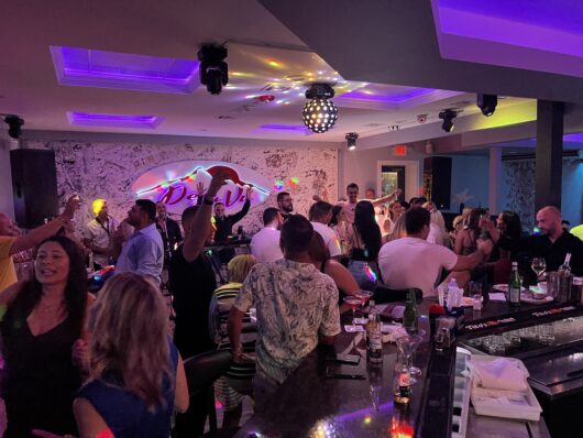 People Dancing at a Bar