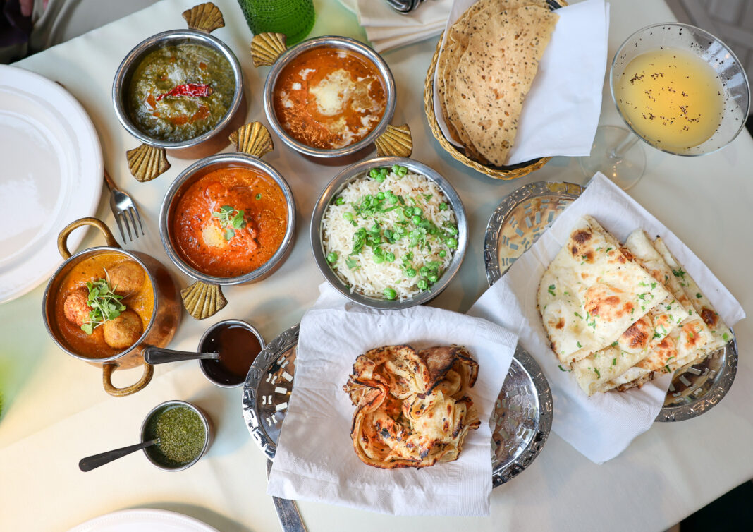 Moghul Restaurant celebrates 40 years overhead shot of Indian dishes on table