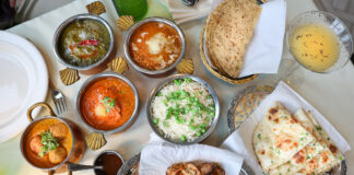 overhead shot of Indian dishes on table