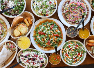 Where to Find Vegetarian and Vegan Food on World Vegetarian Day and Beyond table full of worldFLATS menu items