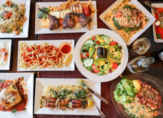 It’s Greek to Me Celebrates Almost 30 Years in Ridgewood table full of Greek food
