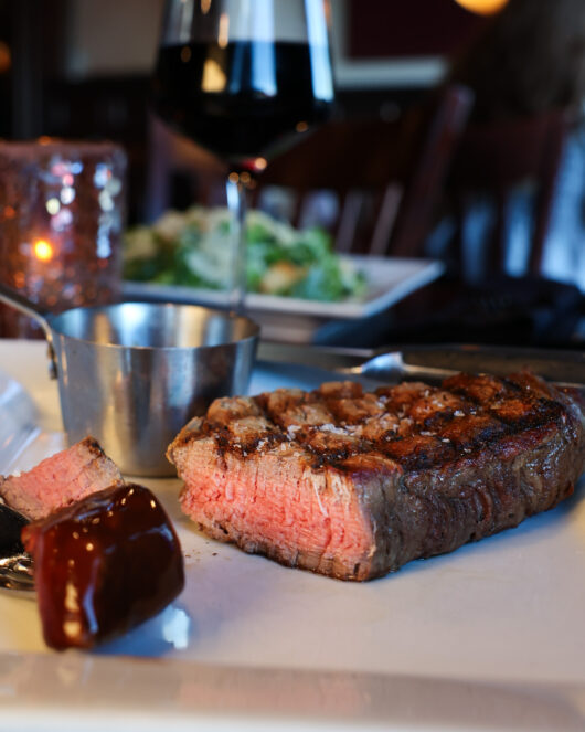 a steak at Sinners Seafood & Steakhouse