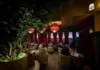Lounge seating at Olea Restaurant in Spring Lake NJ with velvet drapes and maroon fringe chandeliers