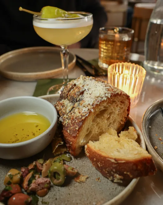 Warm crusty bread served with olives and extra virgin olive oil at Olea Restaurant in Spring Lake NJ