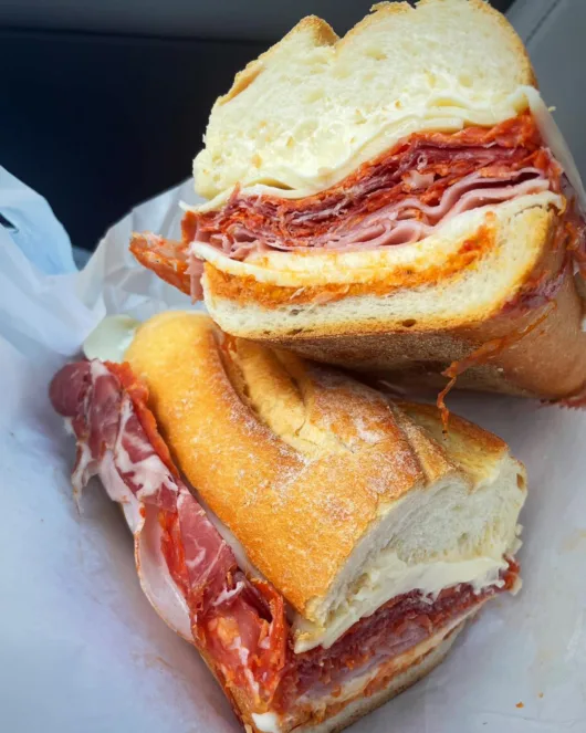 Italian deli sub from Sapore’s loaded with meats, cheese, lettuce, tomato, and oil and vinegar