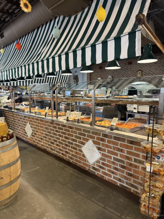 prepared foods counter at Joe Leone's Italian Specialties with Italian dishes salads and take-home meals