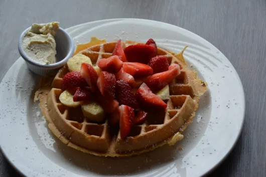 Waffle topped with strawberries and bananas at Ridge Diner in Park Ridge New Jersey