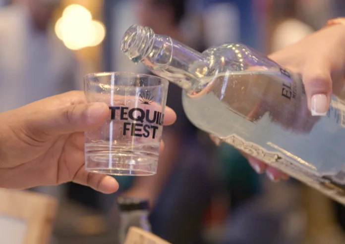 Tequila being poured into a tasting glass at NYC Tequila and Spirits Fest in Jersey City