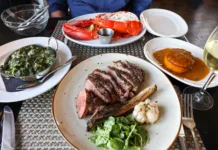 Dry-aged steak dinner spread at Drifthouse in Sea Bright, NJ