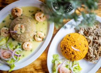 Traditional Puerto Rican mofongo topped with garlic shrimp at Taino's Kitchen in Newark, New Jersey