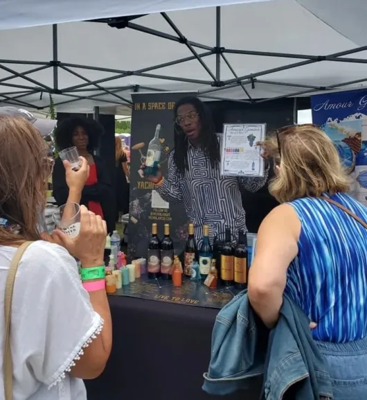 vendor serves tasting at the Asbury Beer Wine & Spirits Fest in Asbury Park, NJ