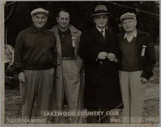 Raef Haddad accompanied by the 1956 Lakewood Country Club Tournament Committee.