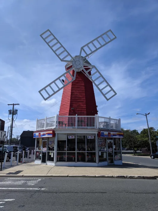 The Iconic WindMill Restaurant in Long Branch Exterior of the iconic WindMill hot dog restaurant with its signature red windmill in Long Branch, New Jersey.