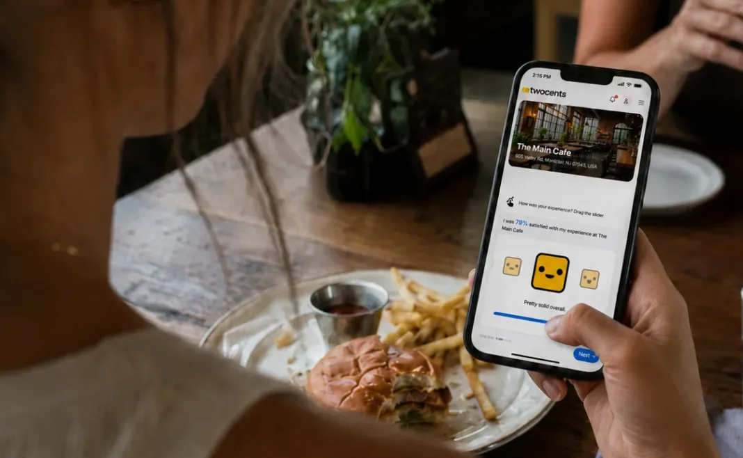 Customer Using the twocents App at a Restaurant A restaurant guest uses the twocents app on her smartphone to share private feedback about her dining experience.