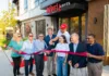 New Restaurant Openings August 2026: Farm-fresh Italian, Pastries, French Cuisine, and more! Group of people pose outside The Inkwell Lofts during a ribbon-cutting ceremony celebrating the opening of the venue.