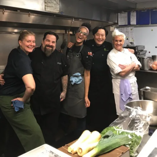 Chopped Champion Chef Eric LeVine with fellow Food Network personalities at a charity event.