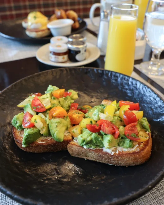 Avocado toast with herbed cream cheese, avocado and cherry tomatoes on sourdough at Beneci’s D’Italia Cucina in Weehawken, NJ