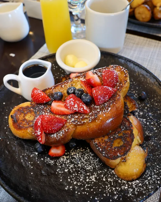 Classic French toast made with challah, Vermont maple syrup and fresh berries at Beneci’s D’Italia Cucina in Weehawken, NJ