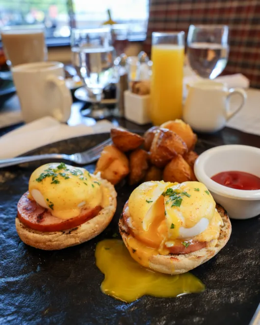 Eggs Benedict with poached eggs, hollandaise sauce and breakfast potatoes at Beneci’s D’Italia Cucina in Weehawken, NJ