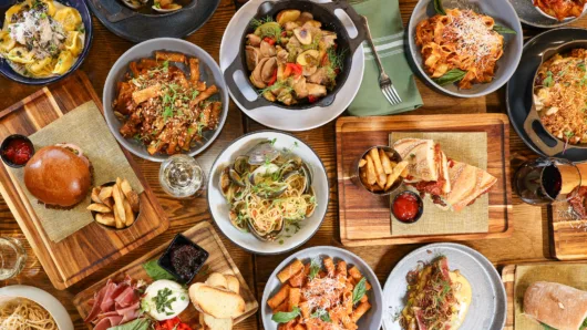 Table filled with brunch and dinner dishes from Paragon American + Italian Gastropub in Clark, New Jersey.