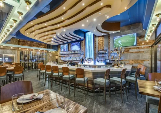 Bar and digital waterfall at Cuzin’s Seafood & Clam Bar in New Brunswick, New Jersey
