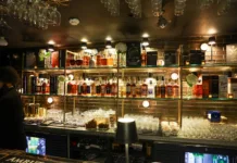 House of Amrut Opens in Jersey City With Rare Whiskies Back bar at House of Amrut in Jersey City displaying an extensive collection of Indian single malt whiskies.
