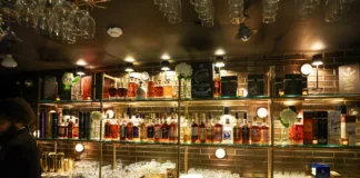 Back bar at House of Amrut in Jersey City displaying an extensive collection of Indian single malt whiskies.