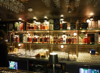 Back bar at House of Amrut in Jersey City displaying an extensive collection of Indian single malt whiskies.