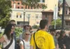 A group gathers for a guided Chow Town food tour on a sunny day in downtown New Jersey.